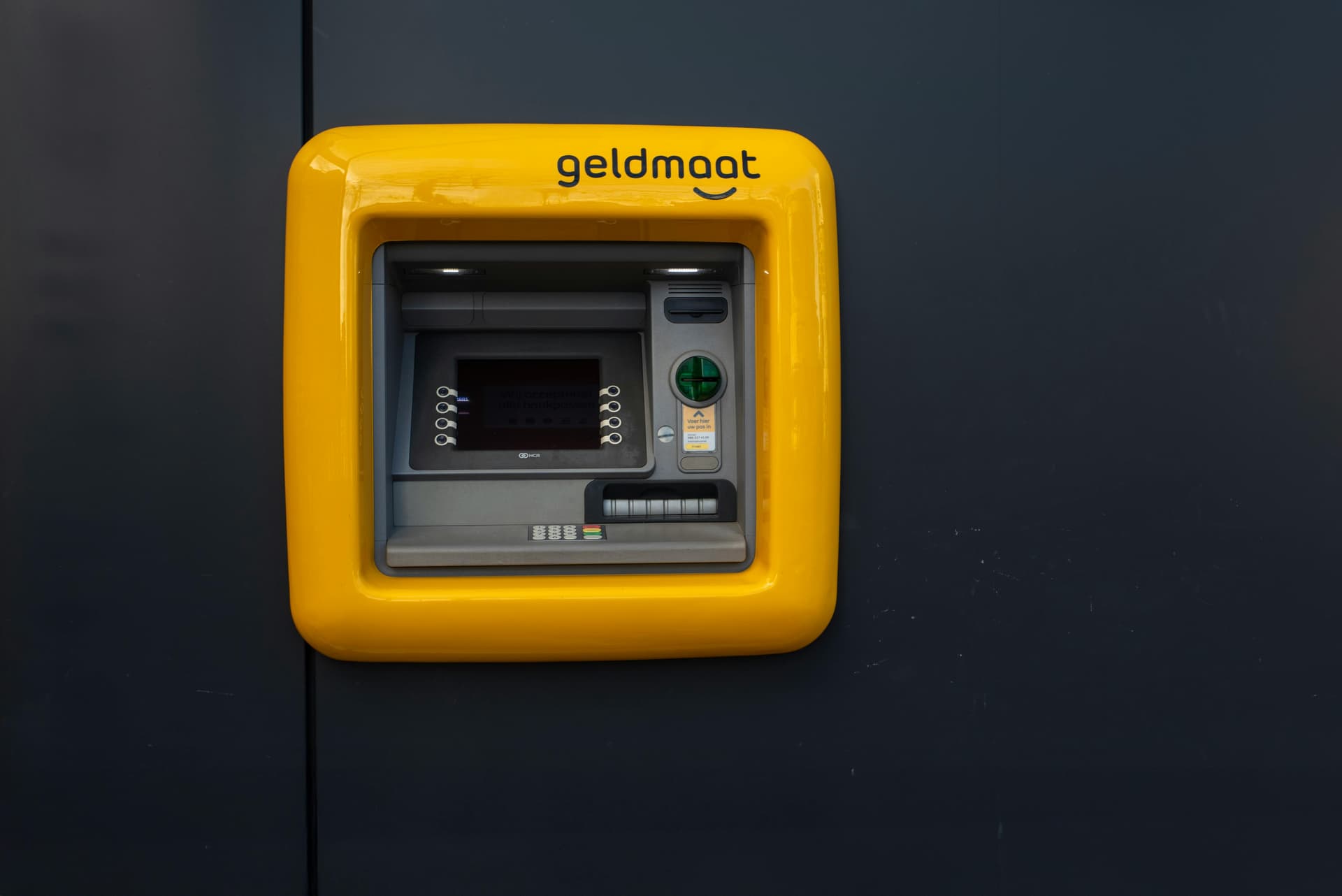 Modern ATM machine mounted on wall